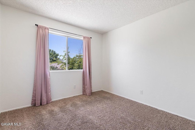 2130 Candice Ave, Rosamond, CA 93560 - carpeted empty room featuring a textured ceiling