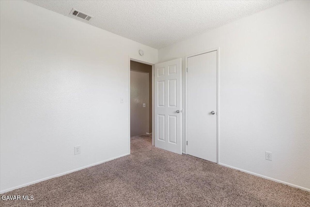 2130 Candice Ave, Rosamond, CA 93560 - unfurnished bedroom with carpet floors and a textured ceiling