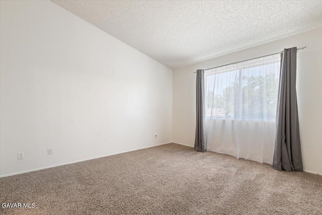 2130 Candice Ave, Rosamond, CA 93560 - unfurnished room with carpet flooring, a textured ceiling, and lofted ceiling