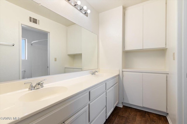 2130 Candice Ave, Rosamond, CA 93560 - bathroom featuring double vanity and a shower