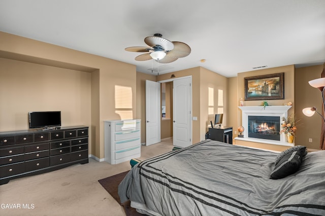 41507 Alexo Dr, Lancaster, CA 93536 - bedroom featuring carpet floors, a glass covered fireplace, and a ceiling fan