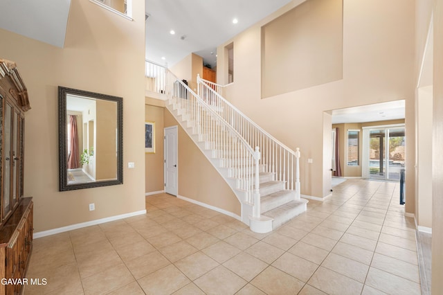 41507 Alexo Dr, Lancaster, CA 93536 - foyer entrance with a towering ceiling, light tile patterned flooring, stairway, and recessed lighting