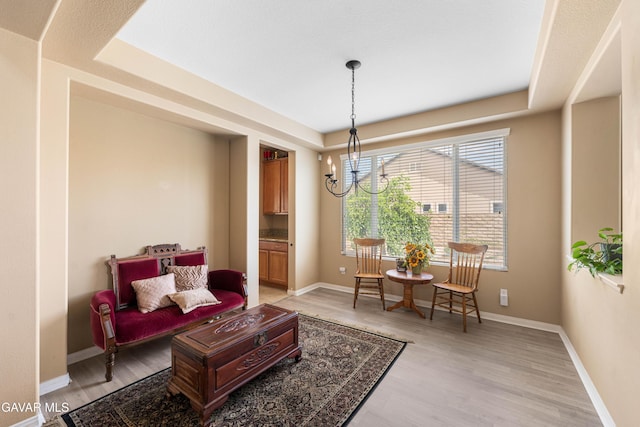 41507 Alexo Dr, Lancaster, CA 93536 - living area featuring a chandelier and light wood-style floors