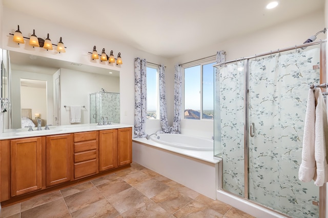 bathroom featuring vanity and plus walk in shower