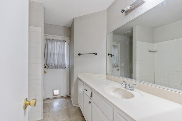 full bathroom with a shower, vanity, and tile patterned floors