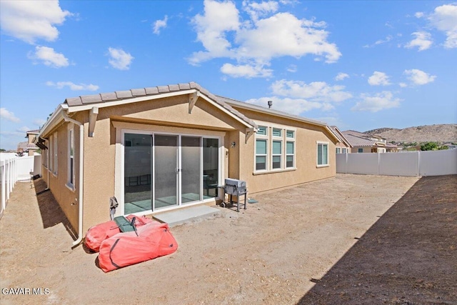 39057 Mondell Pine Ave, Palmdale, CA 93551 - back of property featuring a fenced backyard and stucco siding