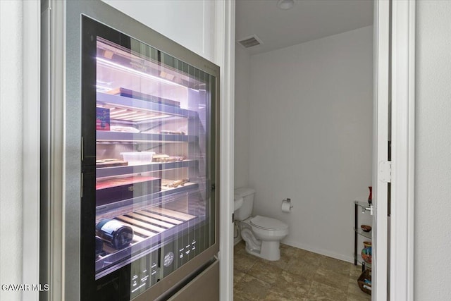 39057 Mondell Pine Ave, Palmdale, CA 93551 - bathroom with wine cooler and toilet