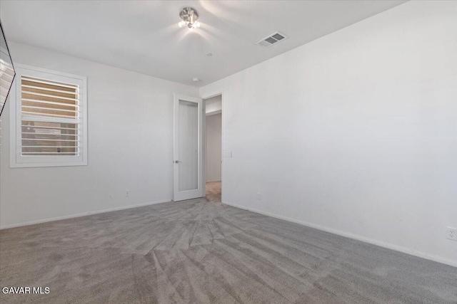 39057 Mondell Pine Ave, Palmdale, CA 93551 - empty room with carpet flooring and baseboards