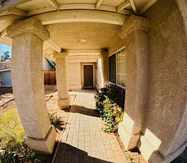 doorway to property with a patio area