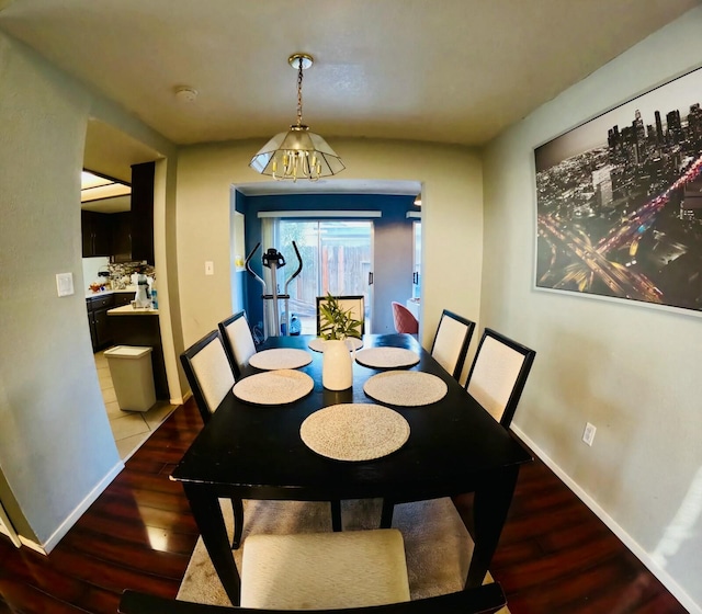 dining area featuring wood-type flooring