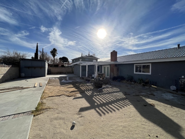 rear view of house featuring a patio