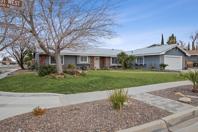 ranch-style home featuring a garage and a front lawn