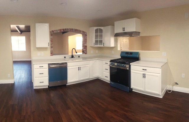 kitchen with stainless steel dishwasher, sink, white cabinets, dark hardwood / wood-style flooring, and range with gas stovetop