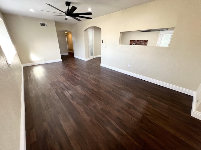 unfurnished room with ceiling fan and dark hardwood / wood-style flooring