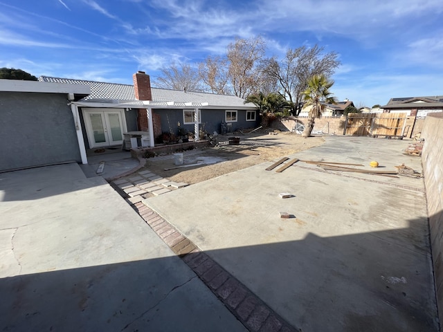 back of house with french doors and a patio