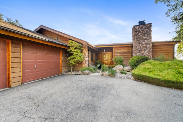 view of front of property featuring a garage