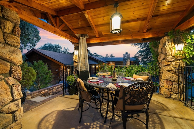 view of patio terrace at dusk