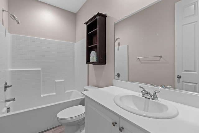 full bathroom featuring toilet, shower / bath combination, hardwood / wood-style floors, and vanity