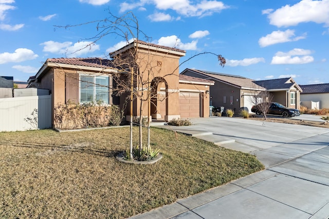 view of front of house with a front lawn and a garage