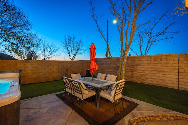 view of patio with outdoor dining area and a fenced backyard