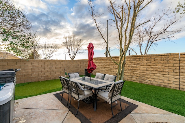 view of patio featuring outdoor dining space and a fenced backyard