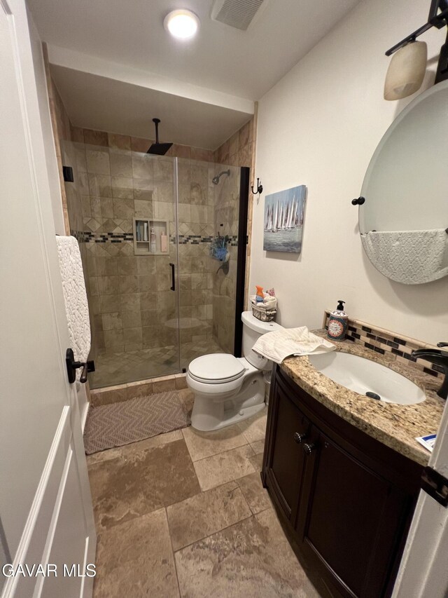 6001 Brougham St, Lancaster, CA 93536 - bathroom with vanity, a stall shower, and stone finish flooring