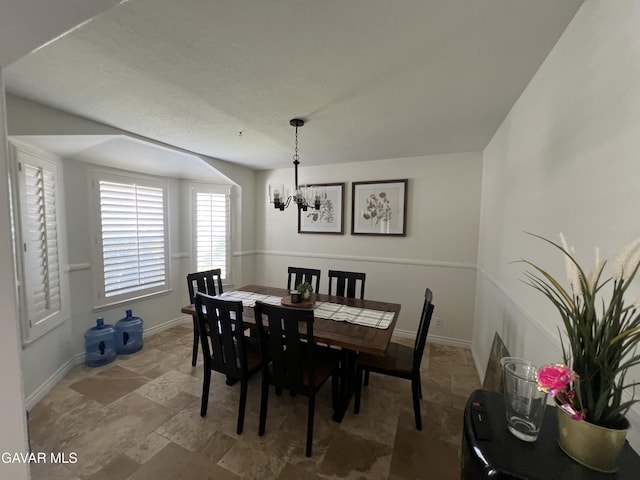 6001 Brougham St, Lancaster, CA 93536 - dining room featuring a chandelier and stone finish flooring