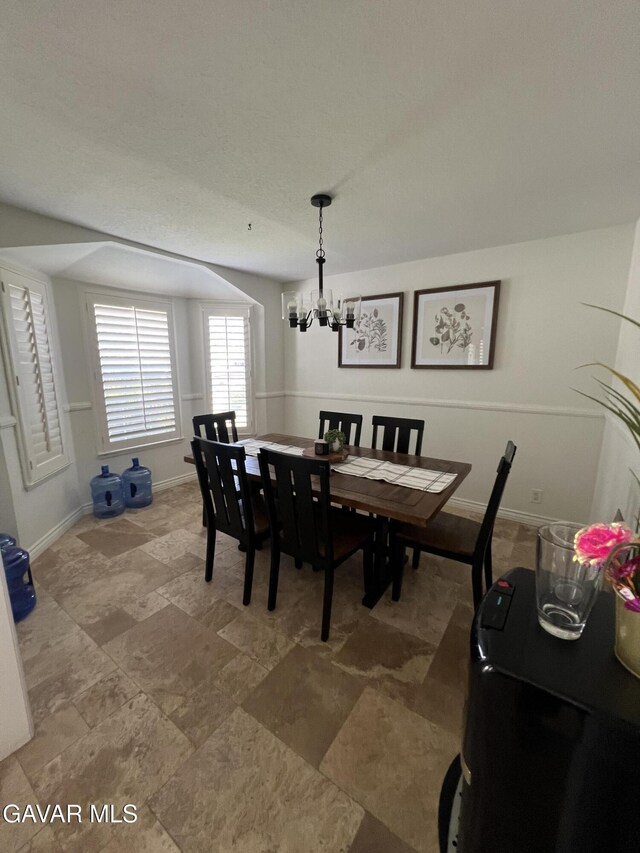 6001 Brougham St, Lancaster, CA 93536 - dining room with a chandelier and baseboards