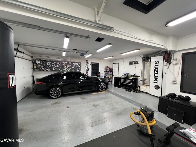6001 Brougham St, Lancaster, CA 93536 - garage featuring water heater