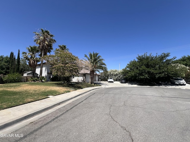 6001 Brougham St, Lancaster, CA 93536 - view of asphalt street with curbs and sidewalks