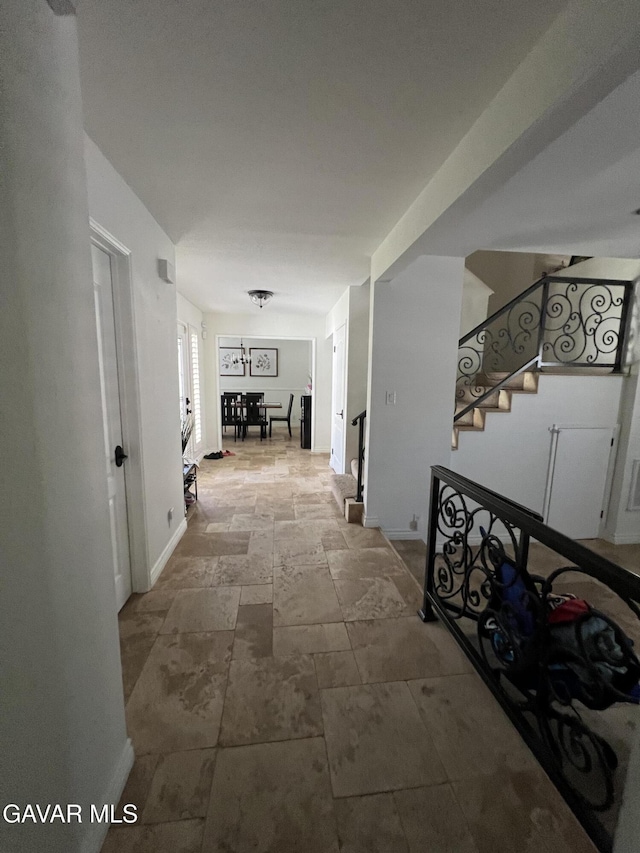 6001 Brougham St, Lancaster, CA 93536 - hallway featuring stairs and stone finish flooring
