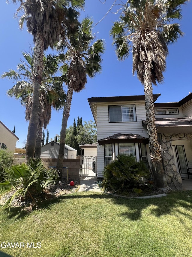 6001 Brougham St, Lancaster, CA 93536 - view of front of home with a gate
