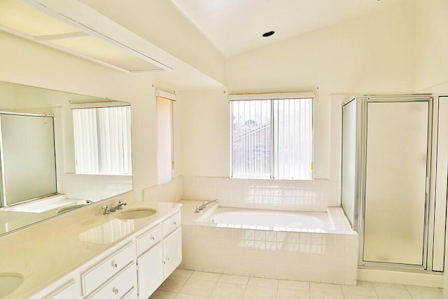 bathroom featuring tile patterned floors, vanity, lofted ceiling, and shower with separate bathtub