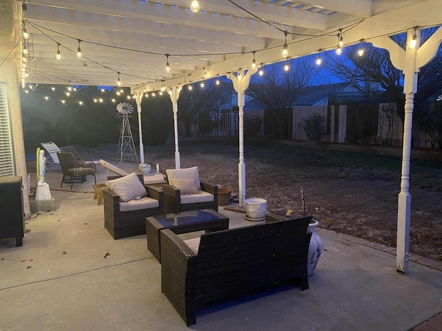 patio at twilight featuring an outdoor hangout area