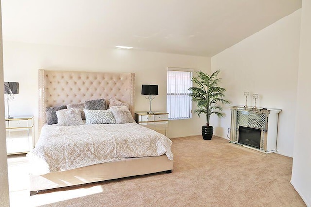 bedroom featuring light colored carpet