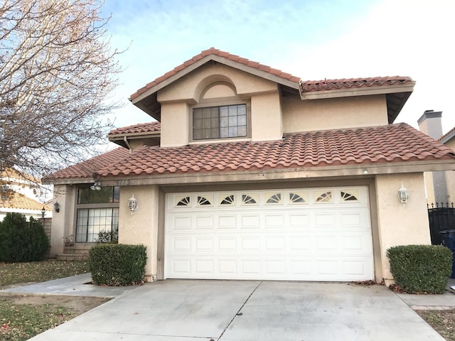 mediterranean / spanish-style house featuring a garage