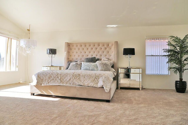 carpeted bedroom with vaulted ceiling