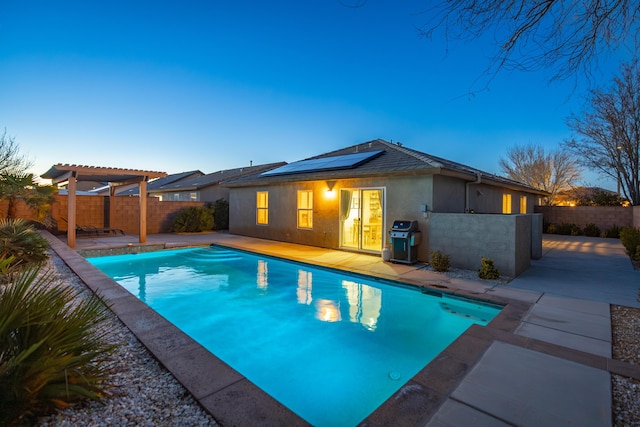 view of swimming pool featuring a fenced in pool, grilling area, a patio area, a pergola, and a fenced backyard