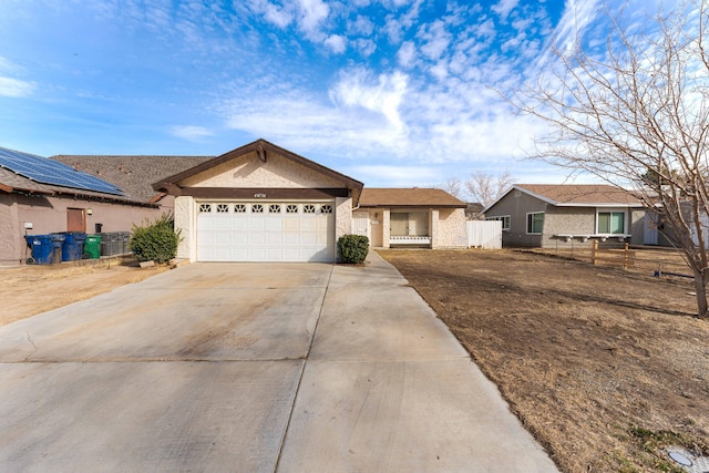 ranch-style home featuring a garage