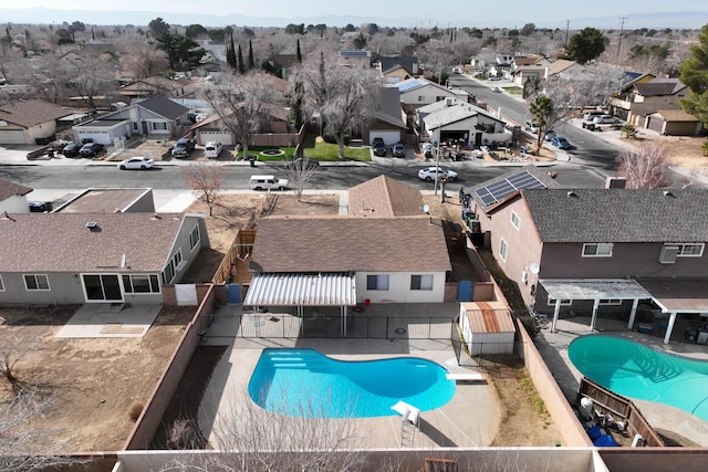 view of swimming pool featuring a diving board and a patio