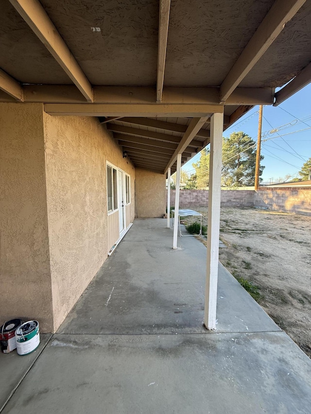 view of patio featuring fence