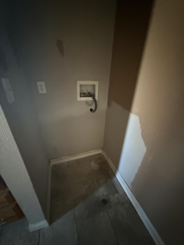 laundry area featuring hookup for a washing machine, baseboards, tile patterned floors, and laundry area