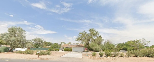 view of front of property with driveway and a garage