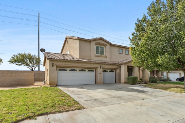 mediterranean / spanish-style house with a garage and a front lawn