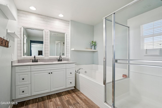 37522 Citron Pl, Palmdale, CA 93551 - bathroom featuring a stall shower, double vanity, a bath, wood finished floors, and recessed lighting