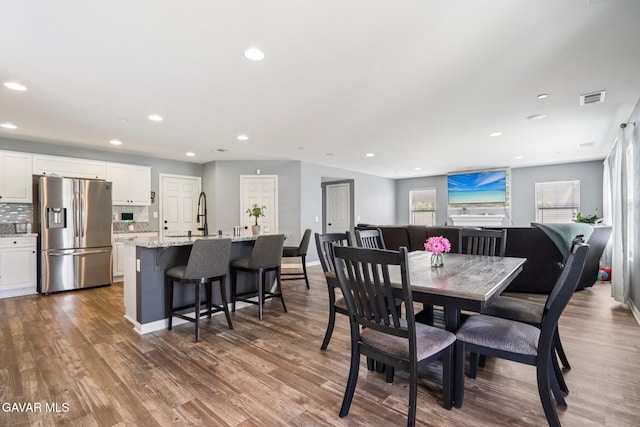 37522 Citron Pl, Palmdale, CA 93551 - dining area featuring recessed lighting, dark wood-style floors, and plenty of natural light