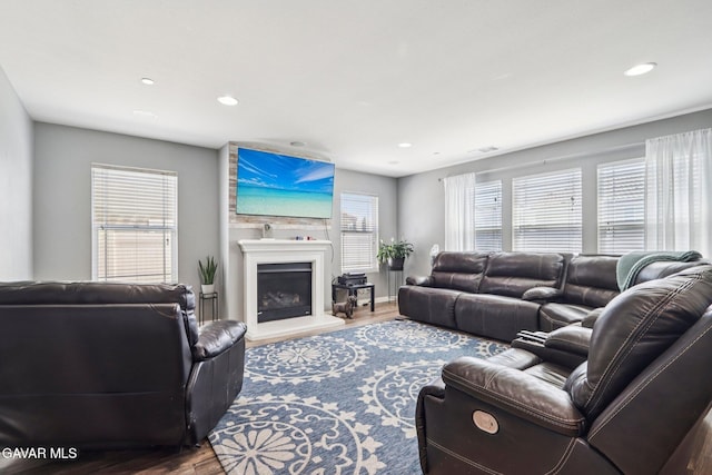 37522 Citron Pl, Palmdale, CA 93551 - living room with wood finished floors, recessed lighting, and a fireplace with raised hearth