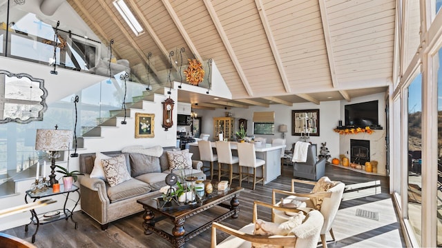 living room featuring beam ceiling, wood ceiling, and wood-type flooring