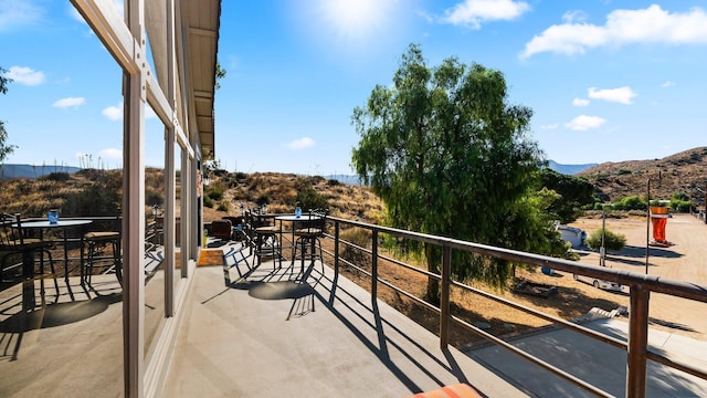 balcony featuring a mountain view