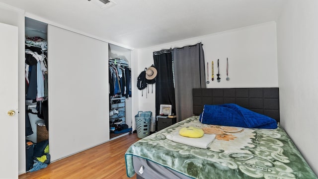 bedroom featuring a closet and light hardwood / wood-style floors